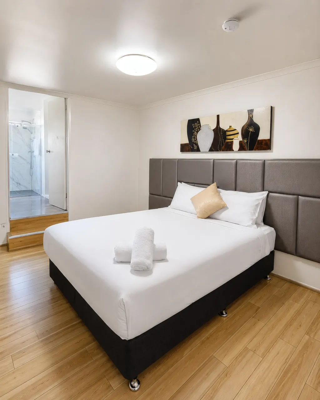 Family Room Apartment — private ensuite with marble-tiled shower