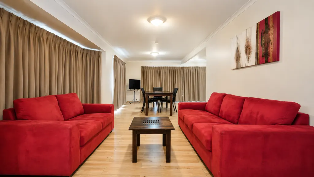 Family Room Apartment — kitchen with fridge, cooktop and sink