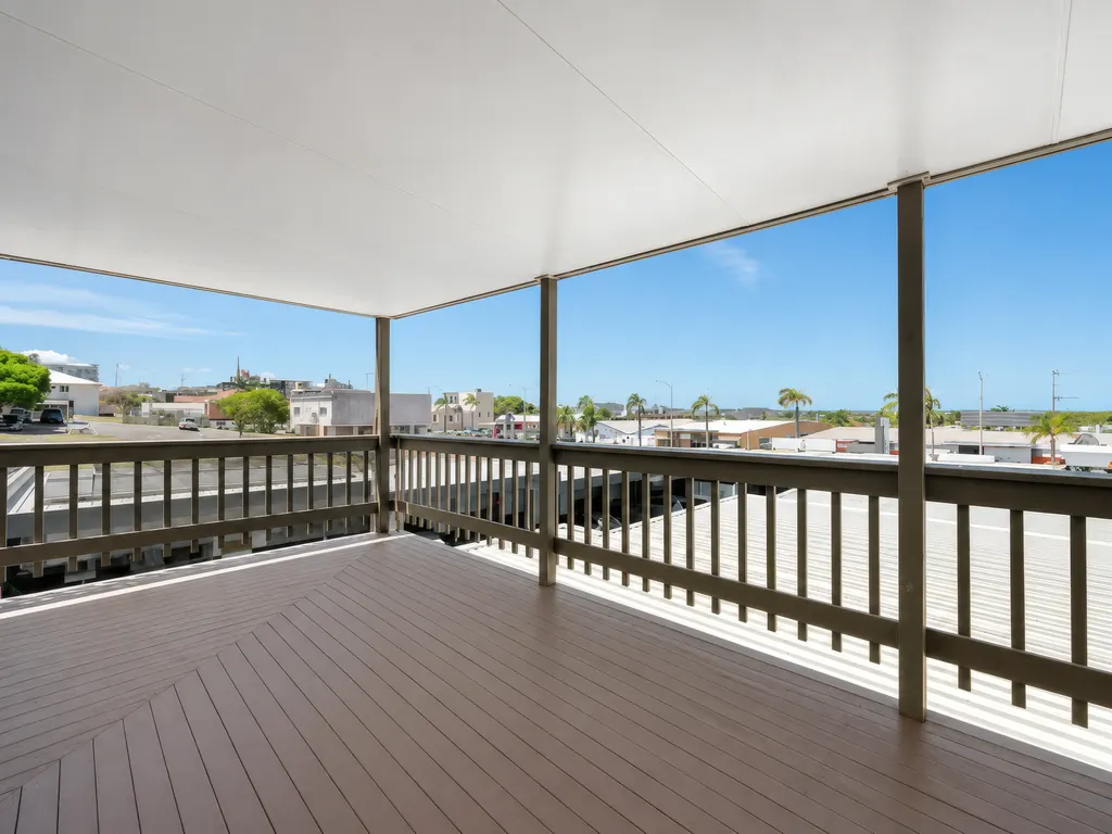 Covered upstairs balcony overlooking the street