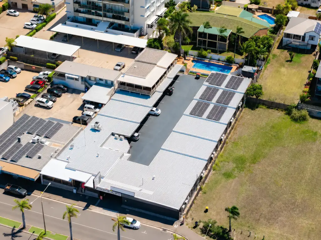 Aerial view of the motel rooftop, courtyard and parking