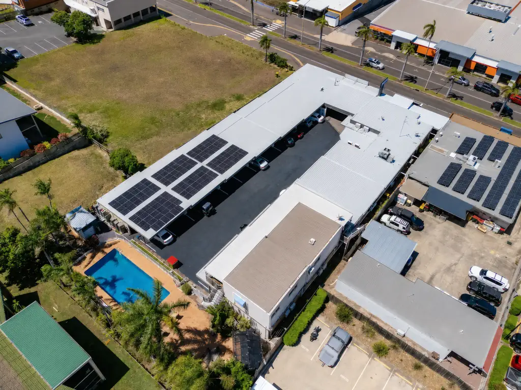 Aerial view of the pool, rooftop and solar panels